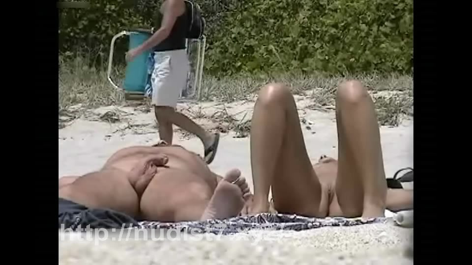 Beauty  nudist putting sunscream on her mounds