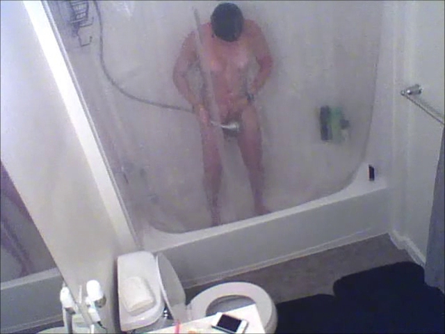 Hidden spy web camera of house guest in shower