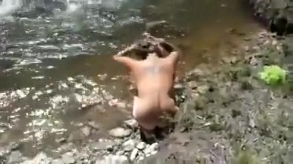 Morgan taking a bath at the river