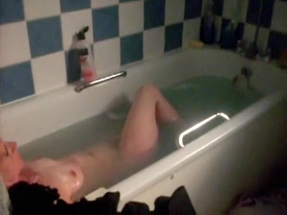 Mature lady lying in a bath voyeur porno