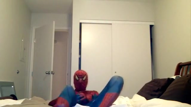 playing in Spiderman suit