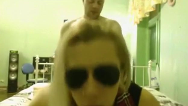 Blonde girl with glasses gets doggystyle fucked with face to the cam