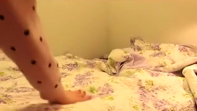 girl plays with herself on her bed and hides her face with her hair