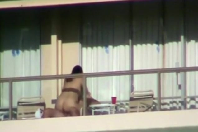 Voyeur tapes a couple having sex on the balcony of their apartment