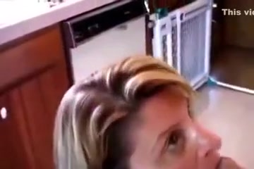 My shameless wife is blowing my swollen cock in the kitchen