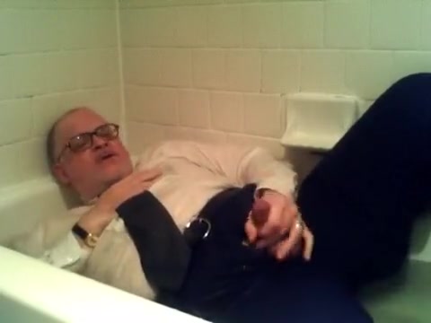 pants shirt and tie and shoes and socks in tub with cum