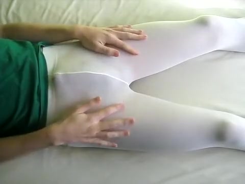 peeing in white pantyhose lying on the bed